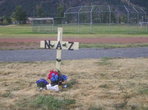A marker tells the palce where a young a man was murdered and his body left in Voght park, the site of the Merritt Country run to promote diversion, for youngsters at risk..... 