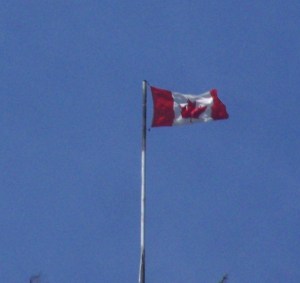 The flag the flies atop the hill entering Merritt from the west hyway 8, it is kept by the ready mix company that owns the land and gravel pit.